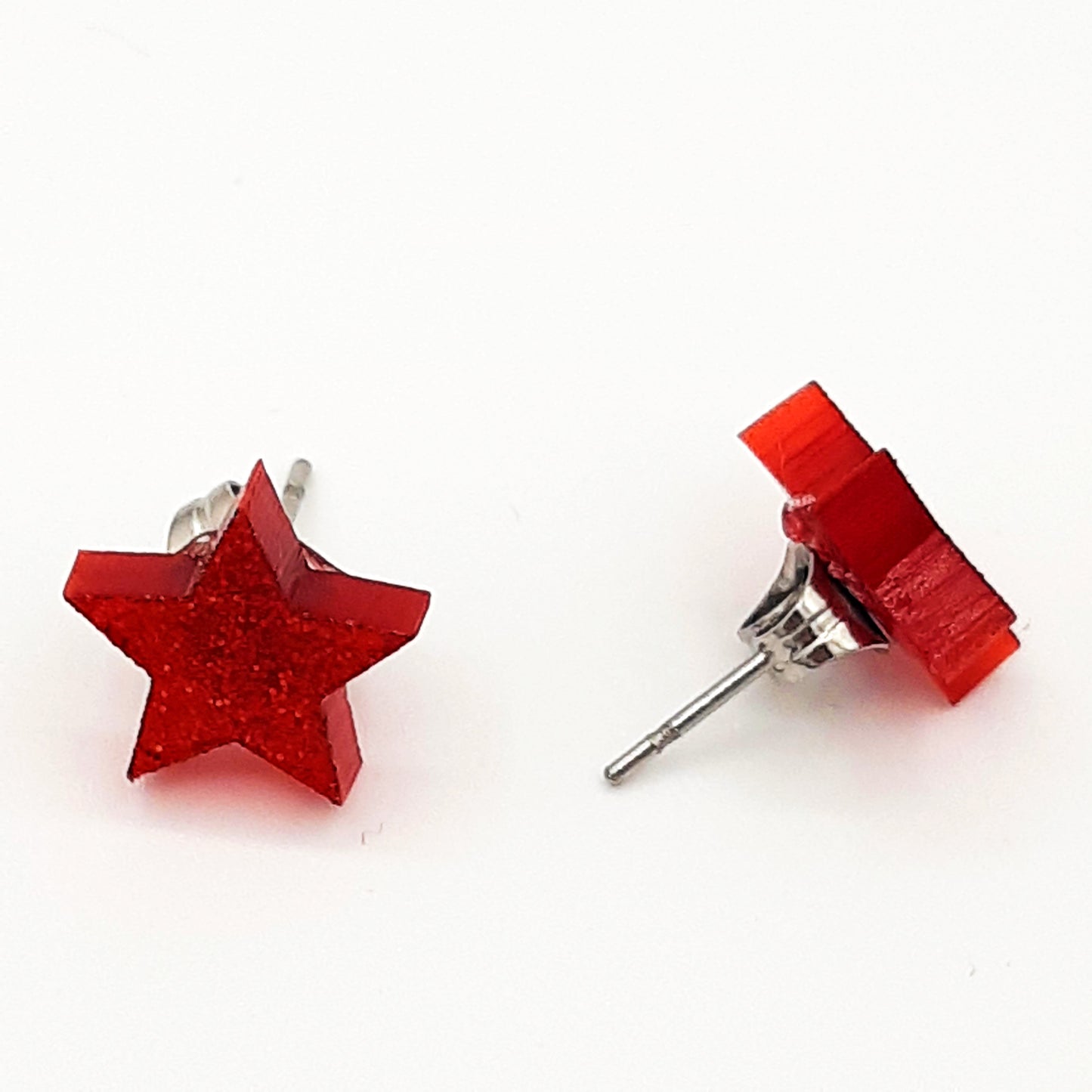 Star laser cut acrylic earrings - red glitter